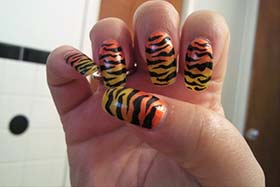 diseño uñas animal print naranjas